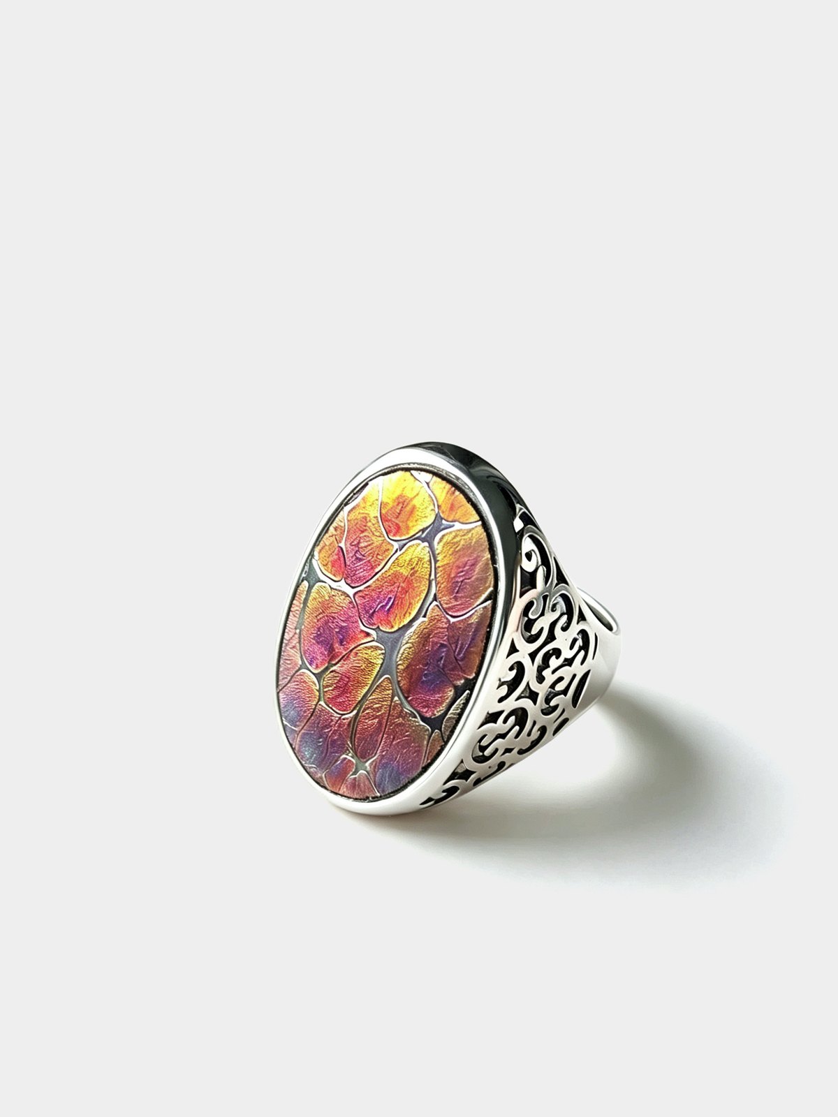 Amethyst cloud ring with kiln-fired Jianzhan glaze in silver bezel